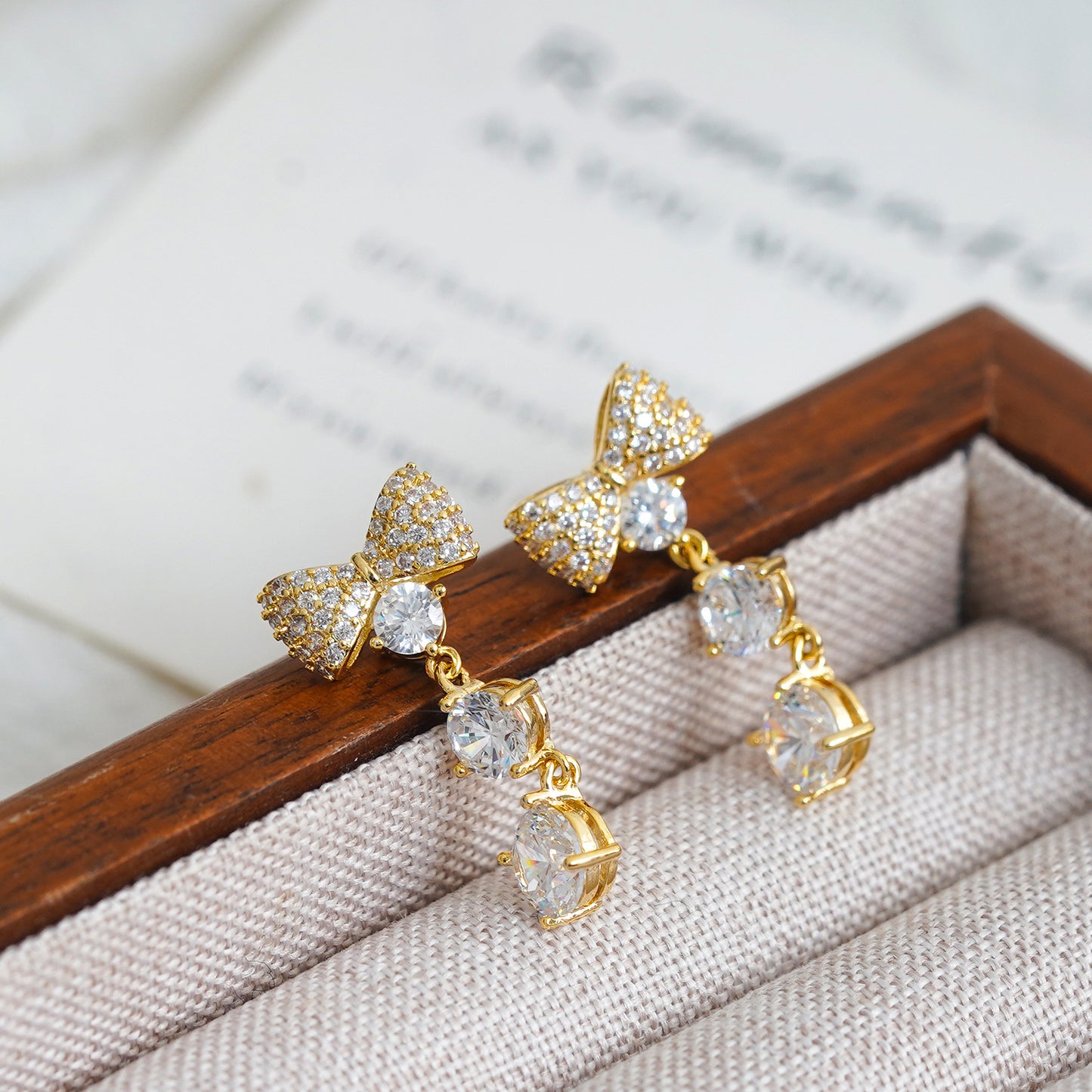 Internet celebrities with the same bow zircon stud earrings women's niche earrings temperament versatile holiday gift butterfly tassel earrings