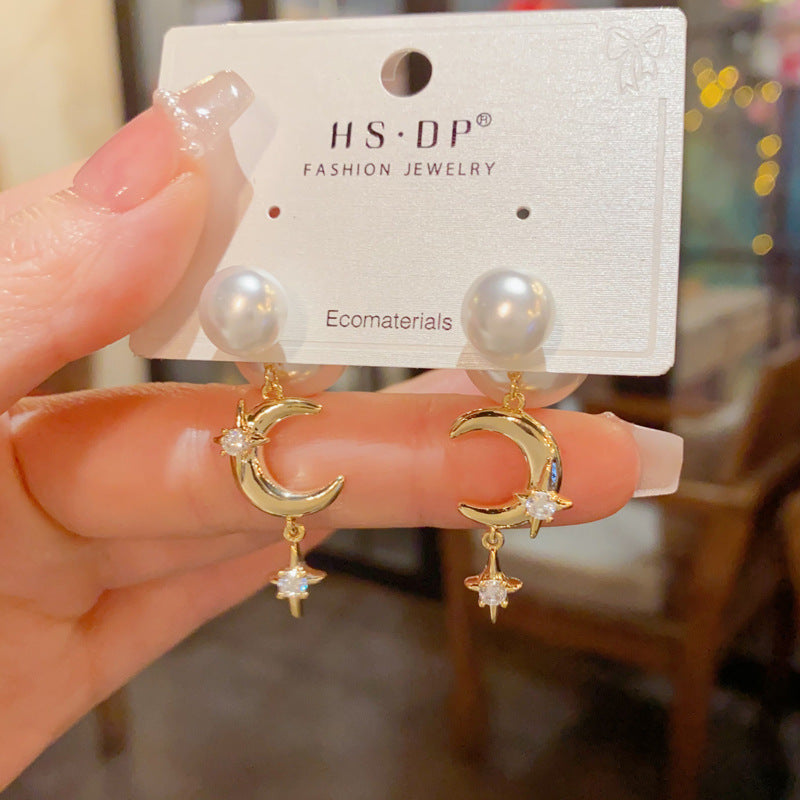 European and American cross-border personalized fashion pearls wear star and moon fringed earrings before and after temperament light luxury gentle versatile earrings women